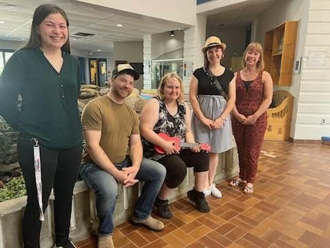 Community members gathered to gift a young student with her own ukelele